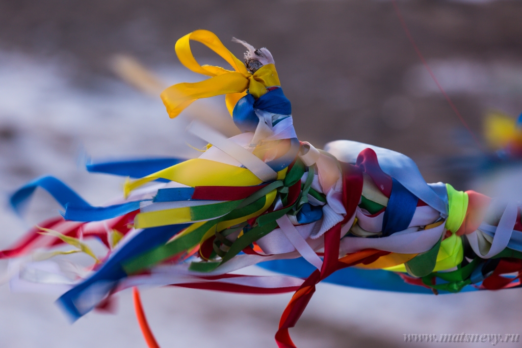 D04B7417.JPG - Colored ritual ribbons tied on the tree and wooden poles as a buddhist tradition on Baikal lake.